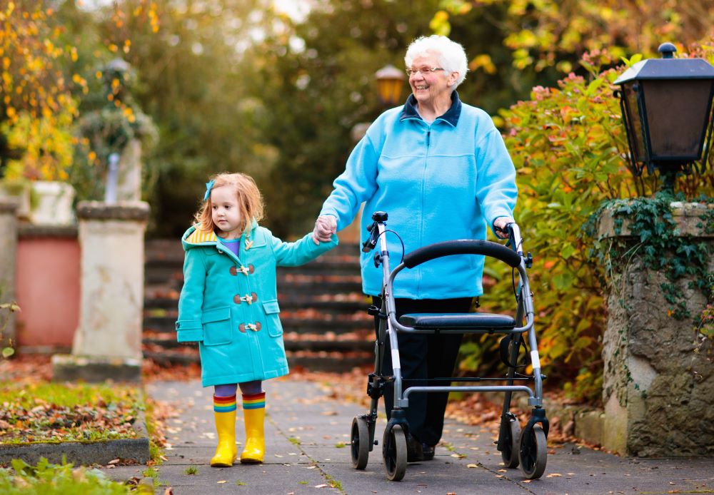 Senior lady with walker enjoying family visit