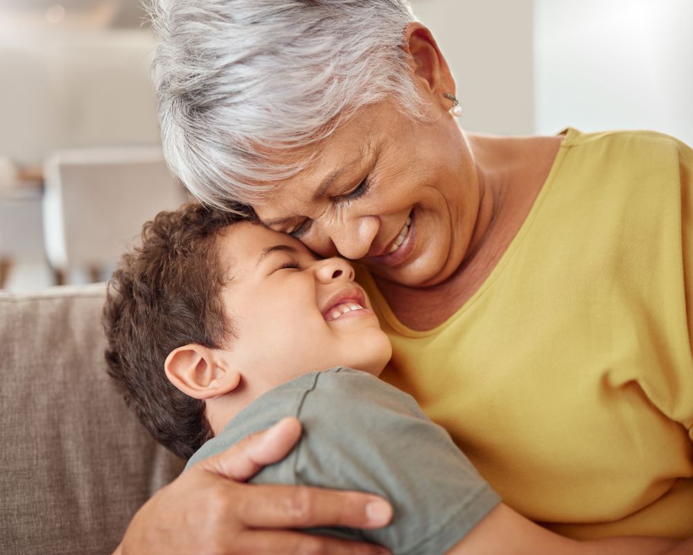 Grandmother hugging her grandson