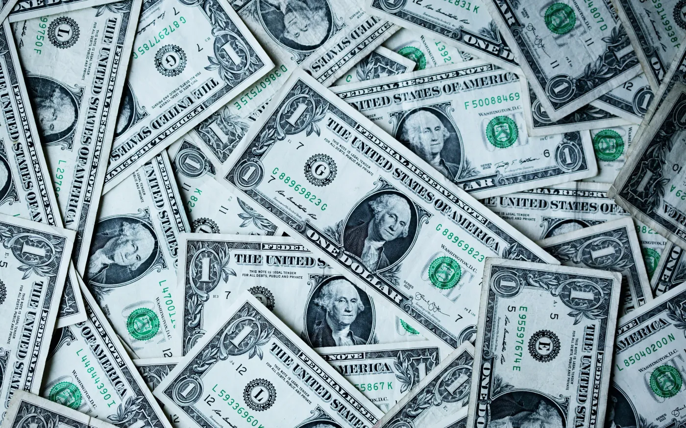 a pile of one-dollar bills