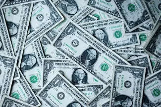 a pile of one-dollar bills