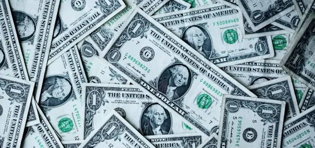 a pile of one-dollar bills